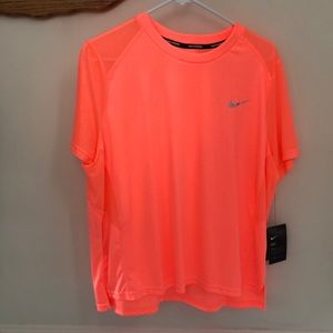 Nike women’s dry-fit running, standard fit 1X tangerine or neon orange color.